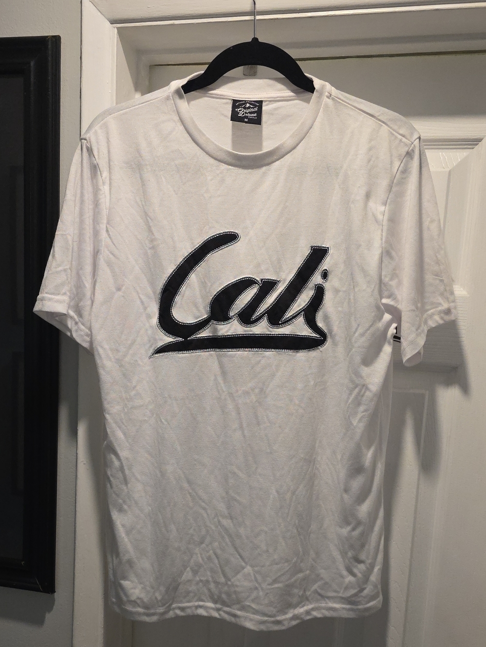 Original Deluxe White Tee with Black 'Cali' Script Logo
